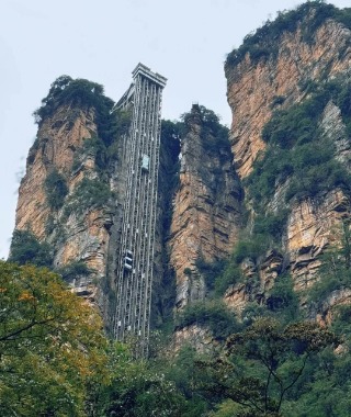 The Bailong Elevator in Zhangjiajie carries tourists up to the mountaintop.