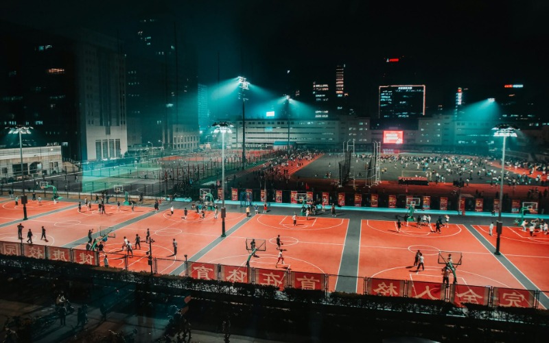 At night, there are many people playing ball in sports courts across China.