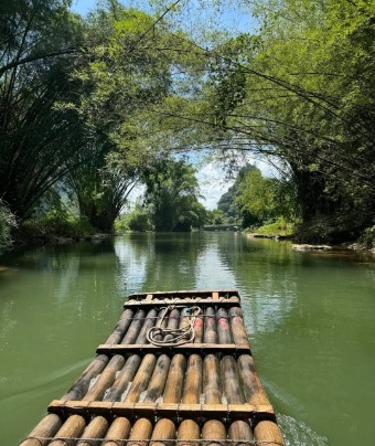 Taking a bamboo raft to tour the Li River.