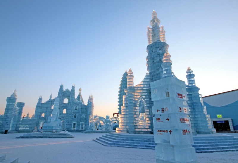 Under the daytime sun, the ice structures appear tall and crystal clear.