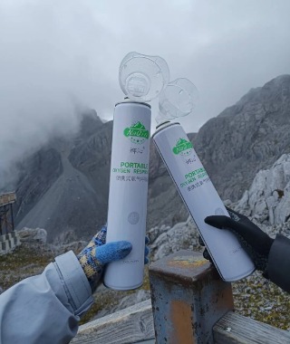 Climbers heading up Jade Dragon Snow Mountain each carry an oxygen bottle.