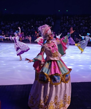 An actor at the Harbin Ice and Snow Festival is waving to the audience.