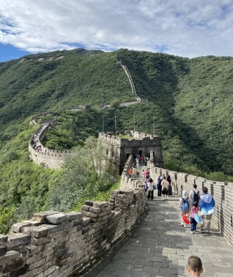 Tourists are climbing the Great Wall.