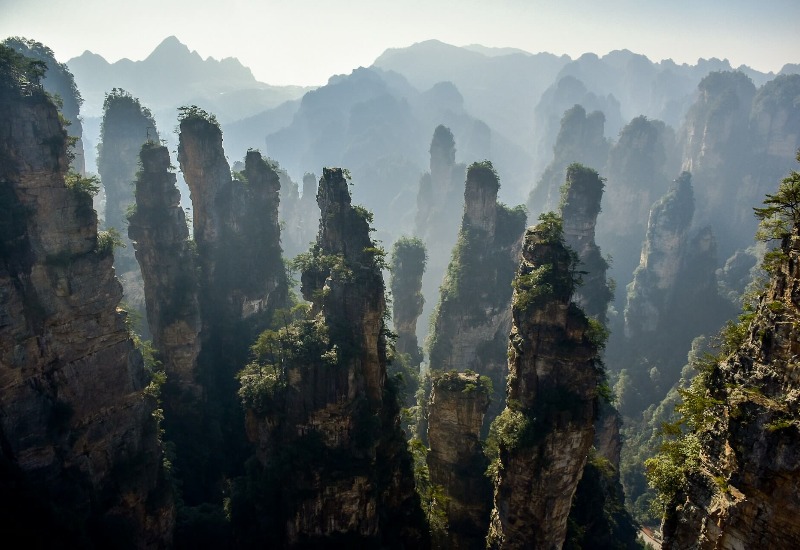 Zhangjiajie Forest Park is filled with towering peaks, each one like a slender pen stuck into the earth.