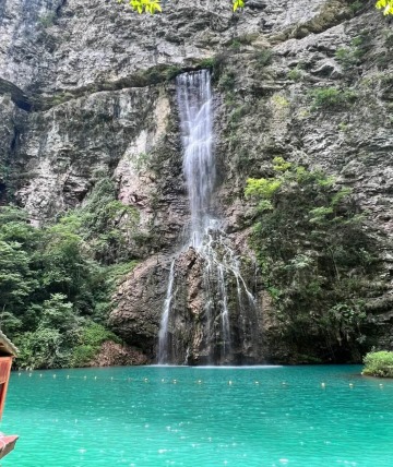 The waterfalls of Zhangjiajie Grand Canyon burst forth from the cliff's rock walls.