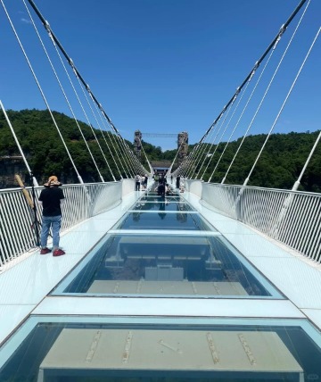 The middle of the China Zhangjiajie Glass Bridge is made up of large glass panels.